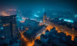 a night view of a city with buildings and street lights