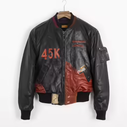 a black leather bomber jacket hanging on a hanger
