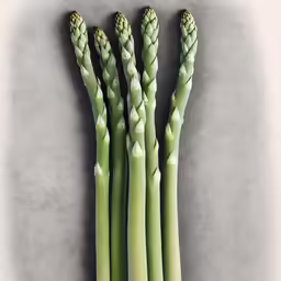a bunch of green asparagus on a table