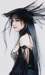 a women who is wearing a black hat