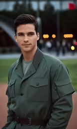 the young man in uniform is posing for a photo