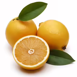 two oranges and one half with leaves on top
