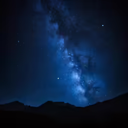 a large night time sky with stars and the milky