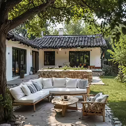 an outdoor living room with some couches in it