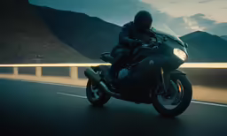 a man riding a motorcycle down the street