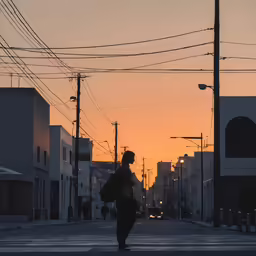 a person with a backpack walking down the middle of the street