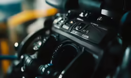 a close - up view of a compact camera with the flash on