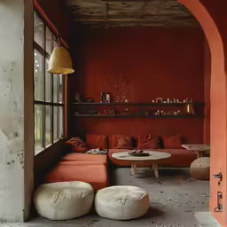 a living room with two seating areas under an arch