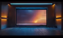 the view from an open area, with lights at the bottom of the picture, of water and sun on the horizon