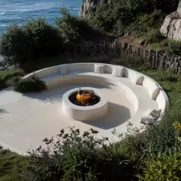 a fire pit sitting on top of a cement slab