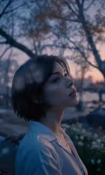 a woman looking out at the trees