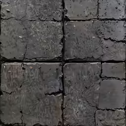 a pattern of black stones on the ground