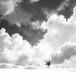 two people in the snow and some clouds