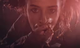 the woman is blowing her nose as if for something
