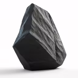 a large black rock sitting in the middle of a white floor