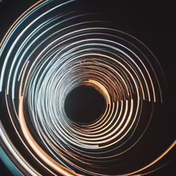 a close up image of some rings and a black background
