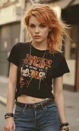a beautiful young lady in ripped jeans poses for the camera