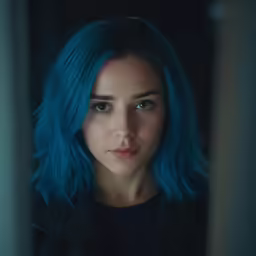 a beautiful woman with blue hair and bright lipstick