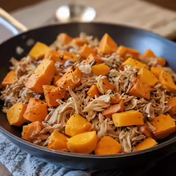 a pan full of chopped and seasoned food with sauce