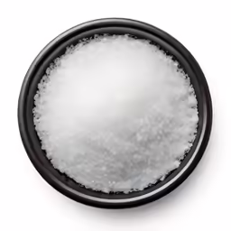 a small round bowl full of white sugar