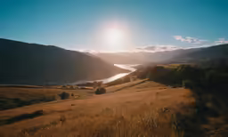 a beautiful view of a valley, grass and trees