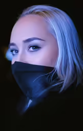 the woman is wearing a mask on her face