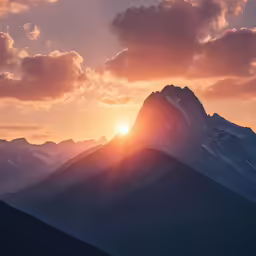 a bright sun shines brightly over mountains