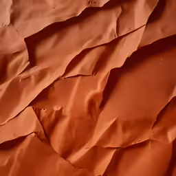 torn brown paper in the corner with a brown background