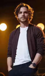 a male in a white shirt and brown jacket