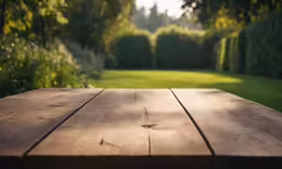 a wooden table in the middle of a garden