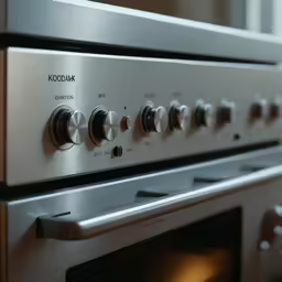 an oven with knobs and a door and knob on it