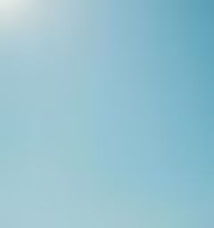 people are on a beach with a sun umbrella