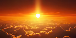 the sun rising over some clouds that are forming a halo