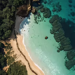 the sandy shore has many stones to make it look like it is surrounded by green land