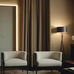 a living room with two chairs that have different color and patterns