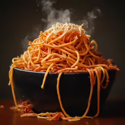 steaming spaghetti in a bowl that is ready to be eaten