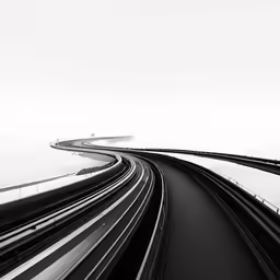 an aerial view of a highway with multiple tracks in black and white