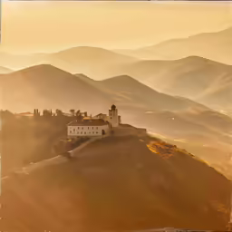 a castle on a mountain side during the day