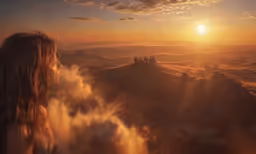 woman looking at a sunset view over the city below