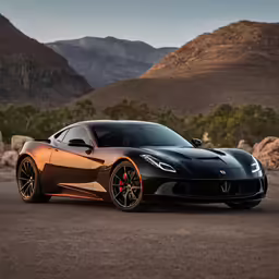 the black sports car is driving down the road