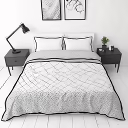 a bed room with a large bed and two pictures on the wall