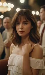 a woman is wearing an off the shoulder top