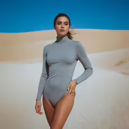 a beautiful young woman wearing a tight bodysuit