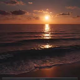 a very pretty sunset at the beach by some water