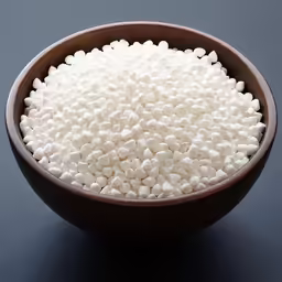 small bowl filled with white rice on a black table