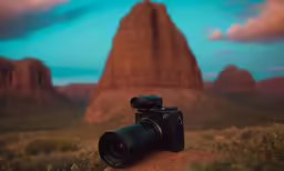 an image of a video camera sitting on a rock