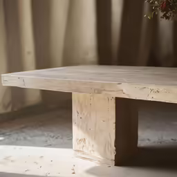 a very old wooden table with little rust in the center
