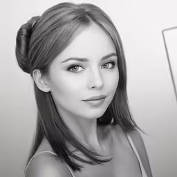 a woman in black and white wearing a pony tail