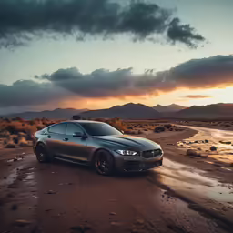 the car is driving through the dirt with its lights on