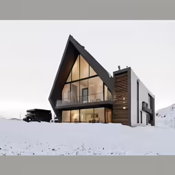 a house that is built into the snow covered mountain side